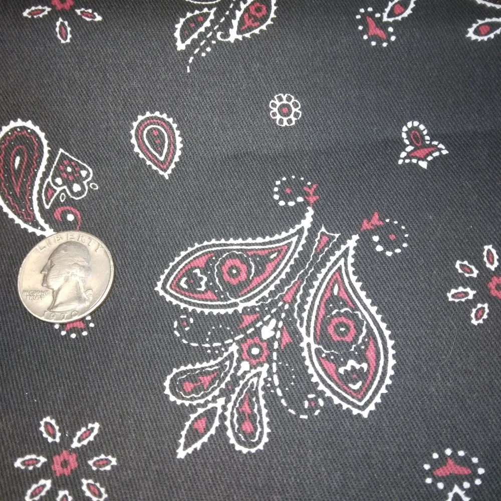 FABRIC Red and white paisley print on black background, twill weave